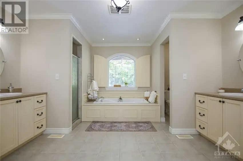 Freshly painted interior hallway with clean white walls and hardwood floors in Ottawa home